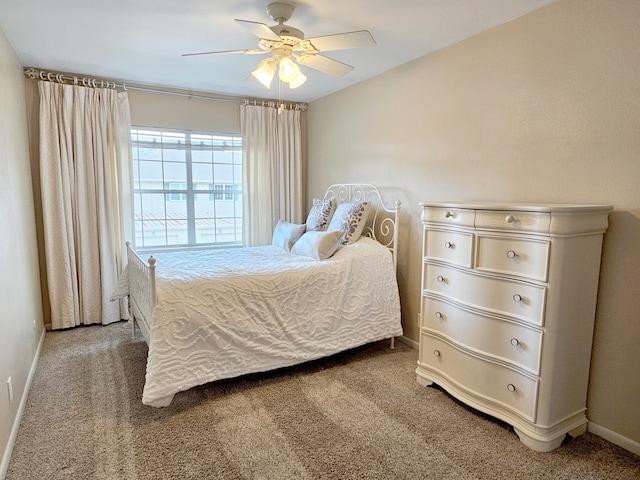 12645 Rip Van Winkle Dr Unit 26, Houston, TX 77024 - bedroom featuring carpet floors, baseboards, and a ceiling fan
