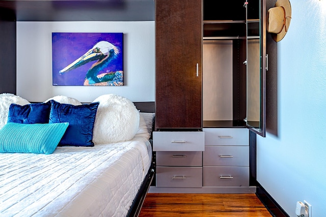 5220 Seawall Blvd Unit 1232, Galveston, TX 77551 - bedroom with wood finished floors and a closet