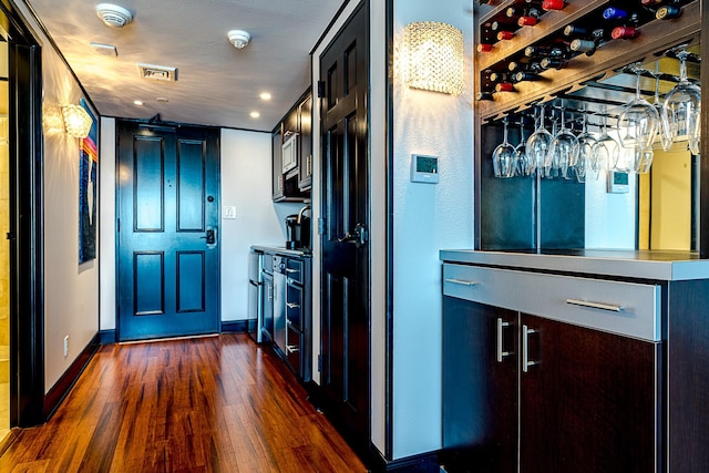 5220 Seawall Blvd Unit 1232, Galveston, TX 77551 - kitchen with dark wood-style flooring, baseboards, and recessed lighting