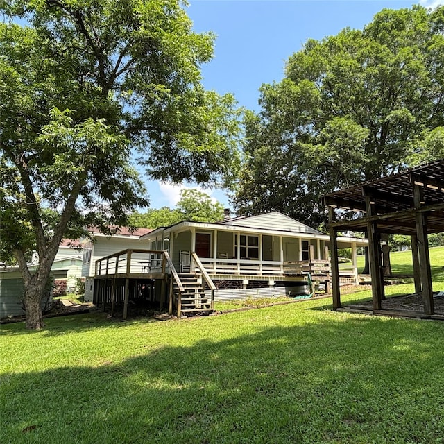 11 Sherry Ln, Coldspring, TX 77331 - back of property with a yard, a wooden deck, and stairway