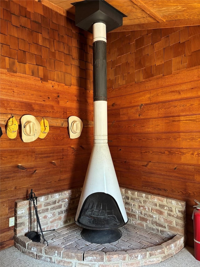 11 Sherry Ln, Coldspring, TX 77331 - detailed view of a wood stove, a fire extinguisher, and wood walls