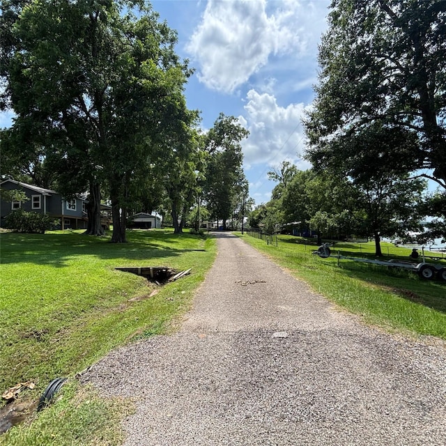 11 Sherry Ln, Coldspring, TX 77331 - view of asphalt driveway