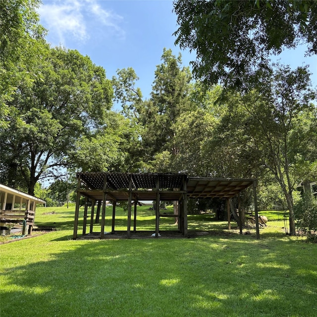 11 Sherry Ln, Coldspring, TX 77331 - surrounding community with a lawn