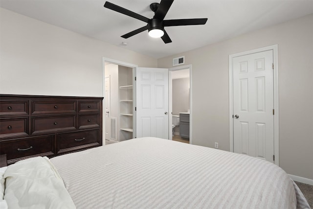 215 Post Office St Unit 1208, Galveston, TX 77550 - bedroom featuring baseboards, ensuite bathroom, a ceiling fan, and carpet