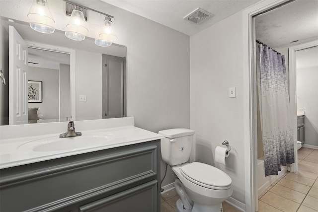 215 Post Office St Unit 1208, Galveston, TX 77550 - bathroom with tile patterned floors, vanity, toilet, and shower / tub combo