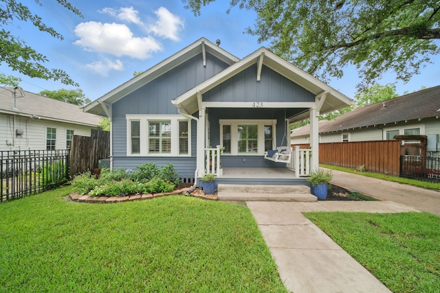 423 Pecore St, Houston, TX 77009 - view of front facade with a porch and board and batten siding