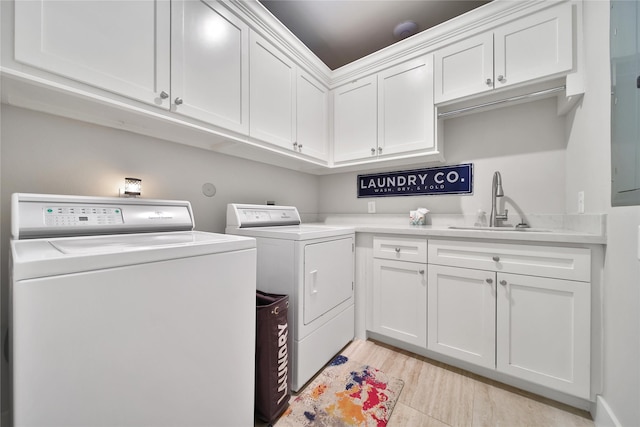 423 Pecore St, Houston, TX 77009 - washroom featuring washing machine and clothes dryer and cabinet space