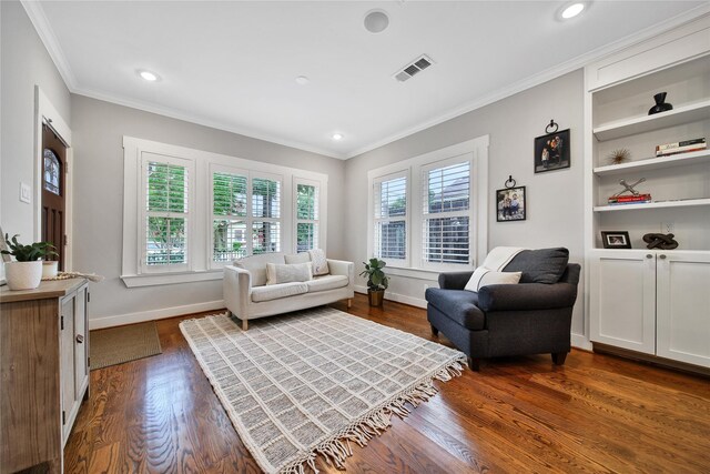 423 Pecore St, Houston, TX 77009 - living room with dark wood finished floors, crown molding, and recessed lighting