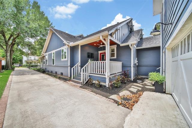 423 Pecore St, Houston, TX 77009 - view of front of property featuring board and batten siding, roof with shingles, and covered porch