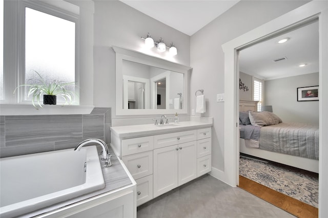 423 Pecore St, Houston, TX 77009 - full bathroom with vanity, a bathtub, and ensuite bathroom