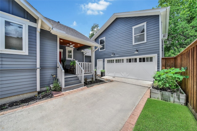 423 Pecore St, Houston, TX 77009 - view of front of home with a porch, concrete driveway, a shingled roof, and ceiling fan