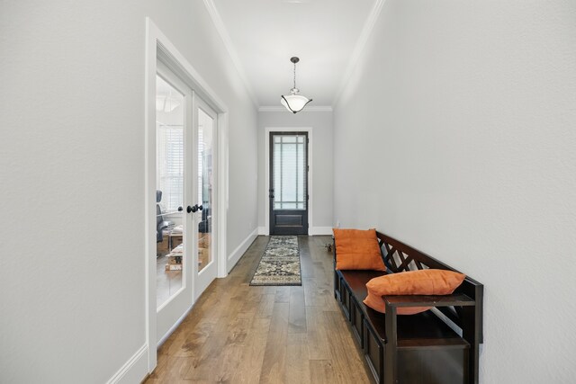 3601 Haskell Hollow Loop, College Station, TX 77845 - foyer entrance with ornamental molding, french doors, light wood-style floors, and baseboards