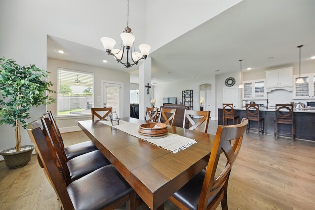 3601 Haskell Hollow Loop, College Station, TX 77845 - dining space with light wood-type flooring, a chandelier, and recessed lighting