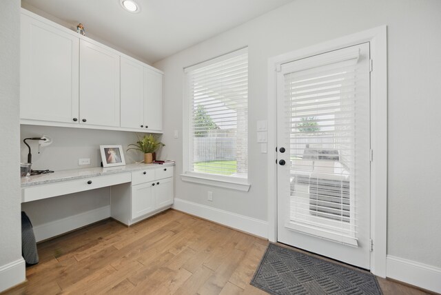 3601 Haskell Hollow Loop, College Station, TX 77845 - office area with built in study area, light wood finished floors, baseboards, and recessed lighting