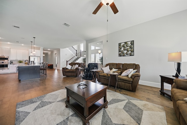 3601 Haskell Hollow Loop, College Station, TX 77845 - living area featuring stairway, hardwood / wood-style flooring, a ceiling fan, baseboards, and recessed lighting