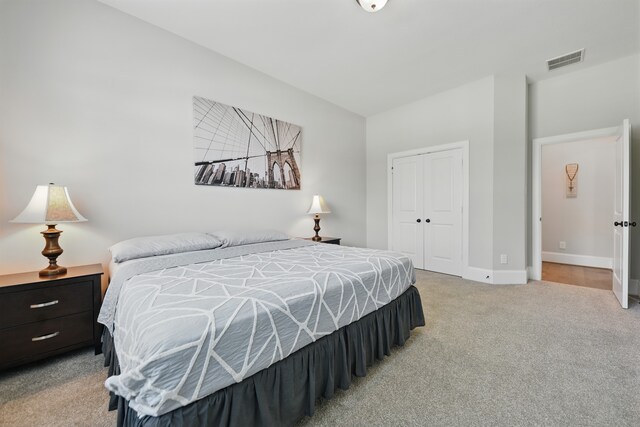 3601 Haskell Hollow Loop, College Station, TX 77845 - bedroom featuring light carpet, a closet, and baseboards