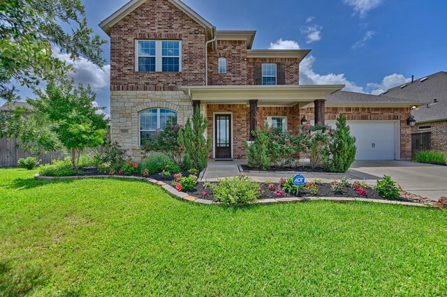 3601 Haskell Hollow Loop, College Station, TX 77845 - view of front of property with concrete driveway, a garage, brick siding, and stone siding