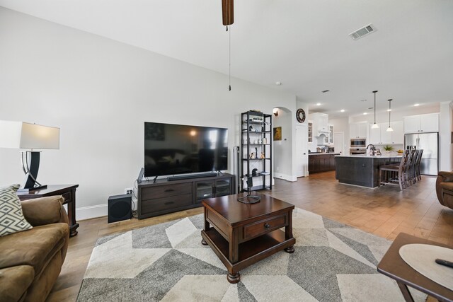 3601 Haskell Hollow Loop, College Station, TX 77845 - living area with wood finished floors, baseboards, recessed lighting, and a ceiling fan