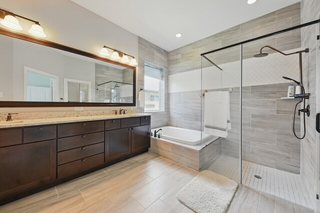 3601 Haskell Hollow Loop, College Station, TX 77845 - bathroom featuring a shower stall, a bath, double vanity, and recessed lighting