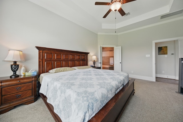 3601 Haskell Hollow Loop, College Station, TX 77845 - bedroom with light colored carpet, a raised ceiling, baseboards, a ceiling fan, and crown molding