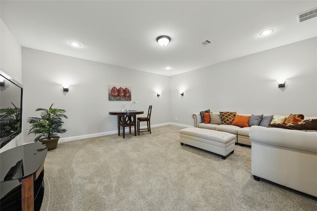 3601 Haskell Hollow Loop, College Station, TX 77845 - living area with light carpet, baseboards, and recessed lighting