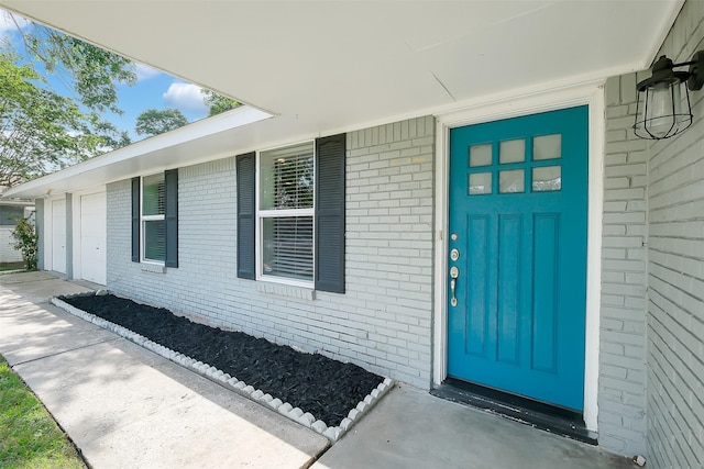 10422 Shadow Wood Dr, Houston, TX 77043 - doorway to property with brick siding and a garage