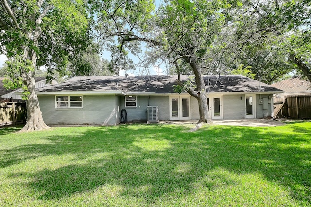 10422 Shadow Wood Dr, Houston, TX 77043 - rear view of property with french doors, brick siding, a patio, cooling unit, and roof with shingles