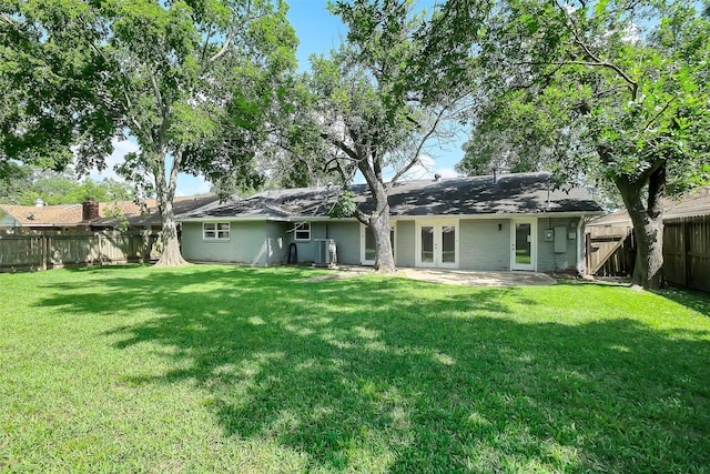 10422 Shadow Wood Dr, Houston, TX 77043 - back of property with french doors and central AC unit