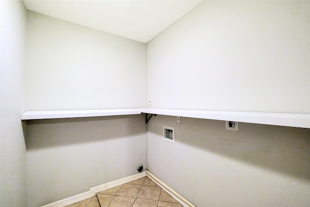 10422 Shadow Wood Dr, Houston, TX 77043 - laundry area with electric dryer hookup, hookup for a washing machine, baseboards, and light tile patterned flooring