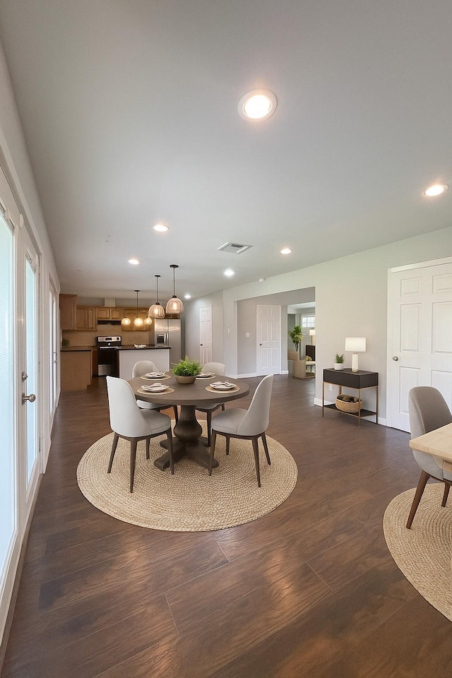 10422 Shadow Wood Dr, Houston, TX 77043 - dining area with recessed lighting and dark wood-type flooring