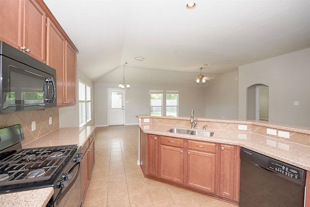 446 De Coster Blvd, Alvin, TX 77511 - kitchen with black appliances, a sink, vaulted ceiling, decorative backsplash, and light tile patterned floors