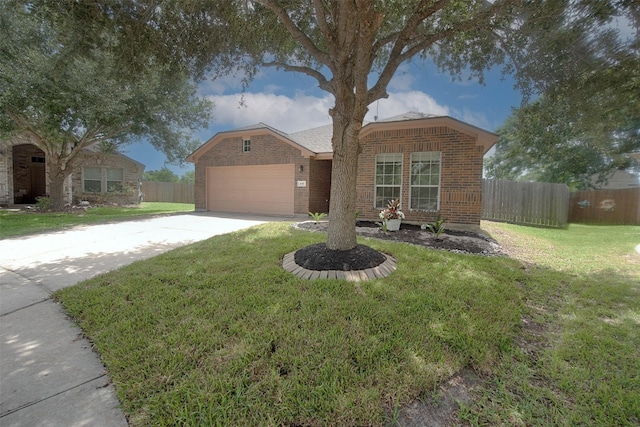 446 De Coster Blvd, Alvin, TX 77511 - ranch-style house with brick siding, concrete driveway, and a garage
