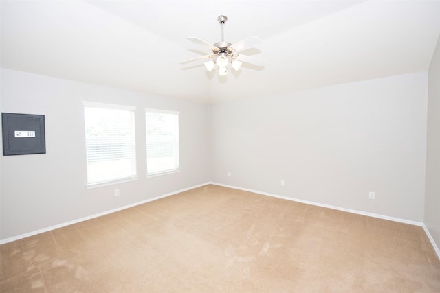 446 De Coster Blvd, Alvin, TX 77511 - empty room featuring electric panel, light colored carpet, baseboards, and ceiling fan