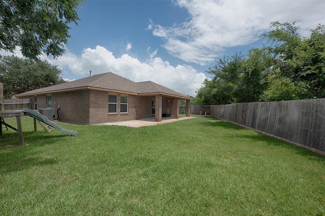 446 De Coster Blvd, Alvin, TX 77511 - back of house with a patio, brick siding, and central AC unit