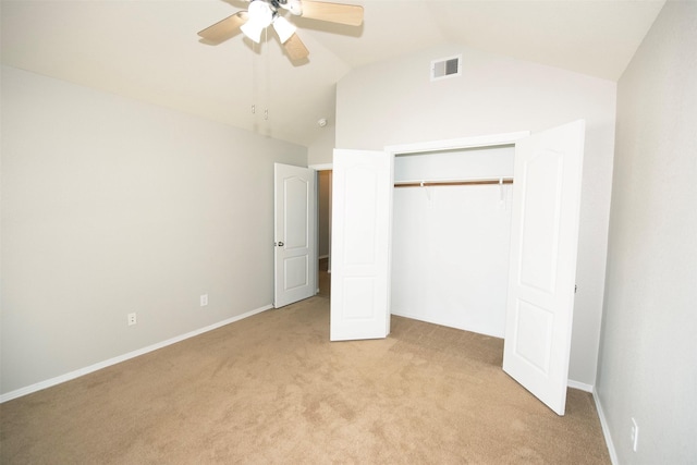 446 De Coster Blvd, Alvin, TX 77511 - unfurnished bedroom featuring light carpet, lofted ceiling, a closet, a ceiling fan, and baseboards