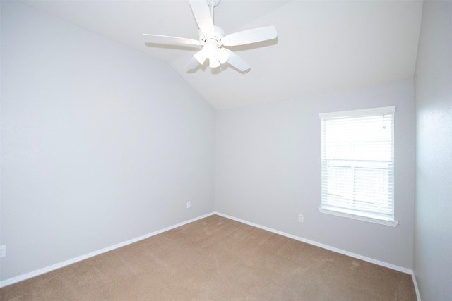 446 De Coster Blvd, Alvin, TX 77511 - spare room with carpet, vaulted ceiling, ceiling fan, and baseboards