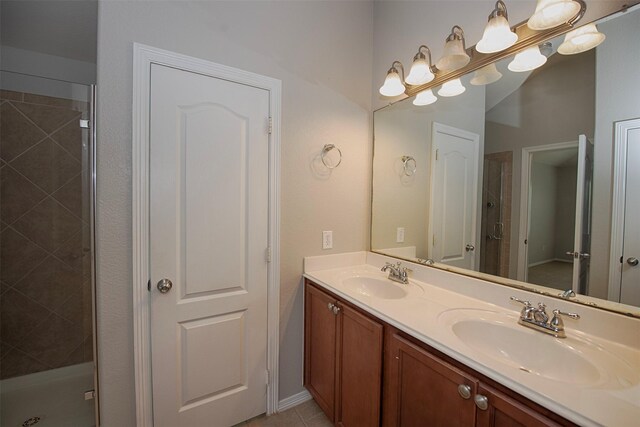 446 De Coster Blvd, Alvin, TX 77511 - full bath featuring a stall shower and double vanity