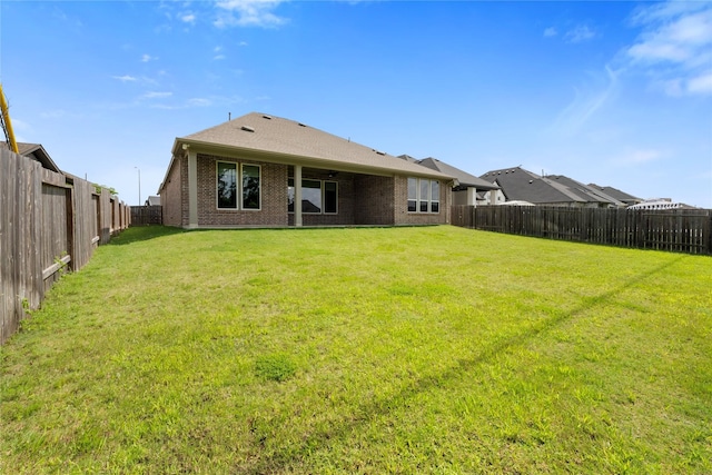 24815 Pavonia Lake Ln, Tomball, TX 77375 - back of house with a fenced backyard and brick siding