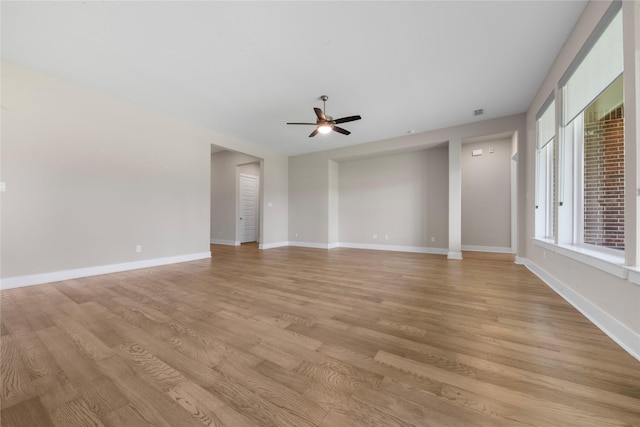 24815 Pavonia Lake Ln, Tomball, TX 77375 - unfurnished room featuring a ceiling fan and light wood-style floors