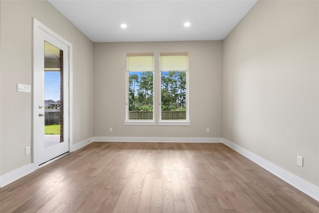 24815 Pavonia Lake Ln, Tomball, TX 77375 - unfurnished room with healthy amount of natural light, wood finished floors, and recessed lighting