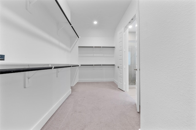 24815 Pavonia Lake Ln, Tomball, TX 77375 - walk in closet featuring light carpet