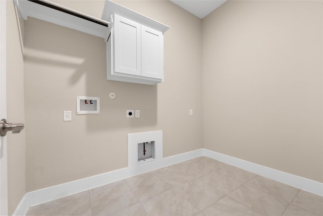 24815 Pavonia Lake Ln, Tomball, TX 77375 - laundry room with gas dryer hookup, electric dryer hookup, hookup for a washing machine, light tile patterned floors, and cabinet space