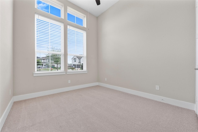 24815 Pavonia Lake Ln, Tomball, TX 77375 - empty room featuring light carpet and ceiling fan