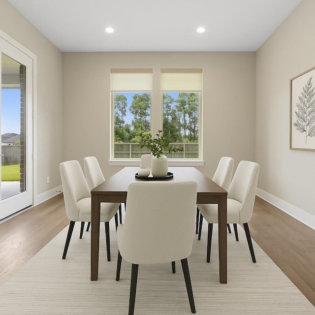 24815 Pavonia Lake Ln, Tomball, TX 77375 - dining area featuring light wood-type flooring and recessed lighting