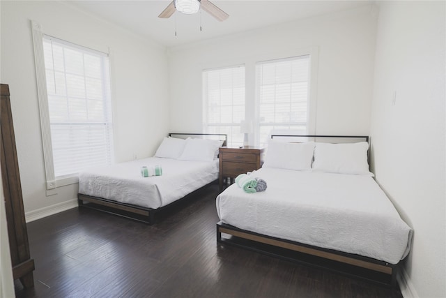 4023 Avenue S, Galveston, TX 77550 - bedroom featuring baseboards, ceiling fan, and wood finished floors
