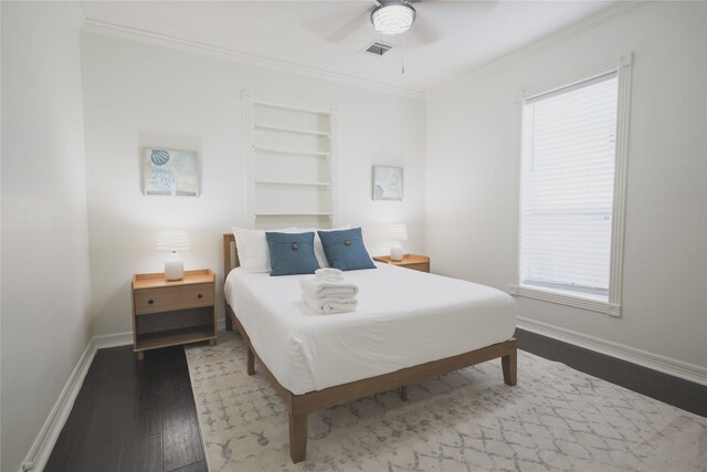 4023 Avenue S, Galveston, TX 77550 - bedroom with wood finished floors, ornamental molding, baseboards, multiple windows, and a ceiling fan