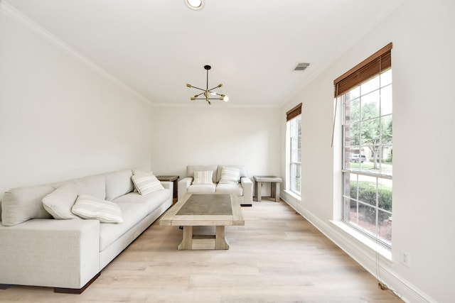 527 Little River Ct, Richmond, TX 77406 - living area featuring ornamental molding, a chandelier, light wood finished floors, and baseboards