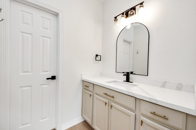 527 Little River Ct, Richmond, TX 77406 - bathroom with vanity, baseboards, and wood finished floors