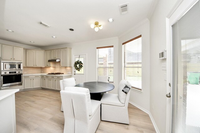 527 Little River Ct, Richmond, TX 77406 - dining room featuring crown molding, light wood-style floors, recessed lighting, and baseboards