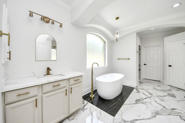 527 Little River Ct, Richmond, TX 77406 - bathroom with vanity, crown molding, a freestanding bath, marble finish floors, and recessed lighting
